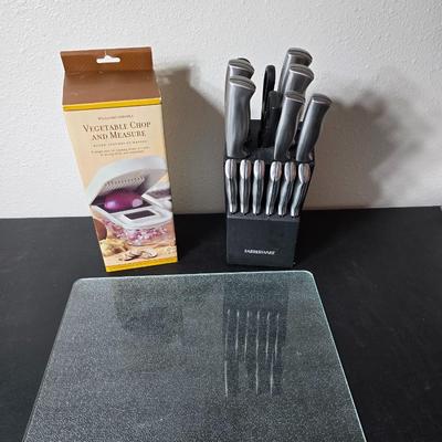 Farberware knife set in Knife block, glass cutting board, Williams Sonoma Vegetable chopper and a Harry & David Contour Pear bamboo...