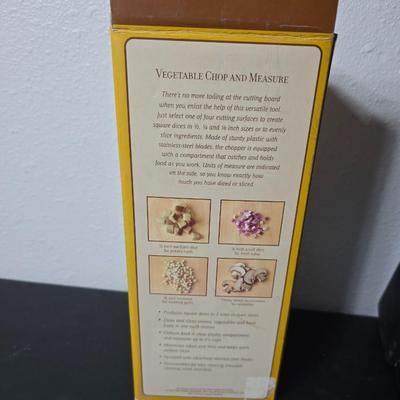 Farberware knife set in Knife block, glass cutting board, Williams Sonoma Vegetable chopper and a Harry & David Contour Pear bamboo...