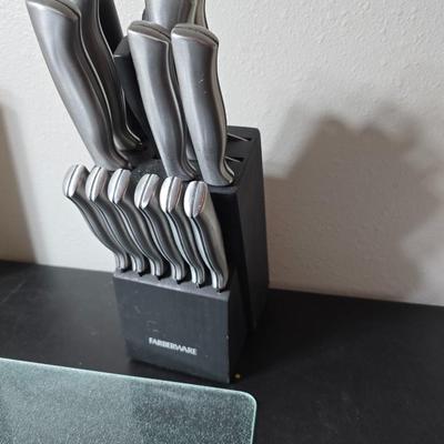 Farberware knife set in Knife block, glass cutting board, Williams Sonoma Vegetable chopper and a Harry & David Contour Pear bamboo...