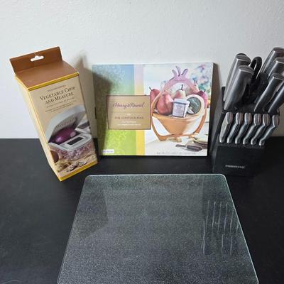 Farberware knife set in Knife block, glass cutting board, Williams Sonoma Vegetable chopper and a Harry & David Contour Pear bamboo...