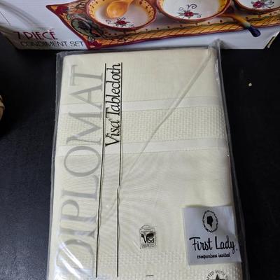 Brand new Corsica 7-piece condiment set - table cloth - and a bread warmer GREAT GIFT IDEAS!