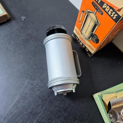 Vintage set of Griswold Patty Molds - Mirro "New Easy-Grip Cooky Press" in its original box and a vintage combination cake...