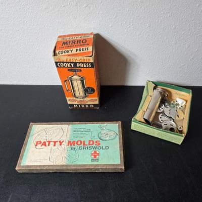 Vintage set of Griswold Patty Molds - Mirro "New Easy-Grip Cooky Press" in its original box and a vintage combination cake...