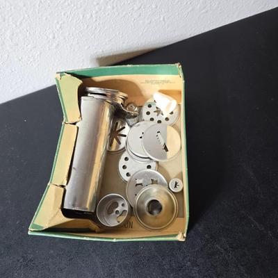 Vintage set of Griswold Patty Molds - Mirro "New Easy-Grip Cooky Press" in its original box and a vintage combination cake...