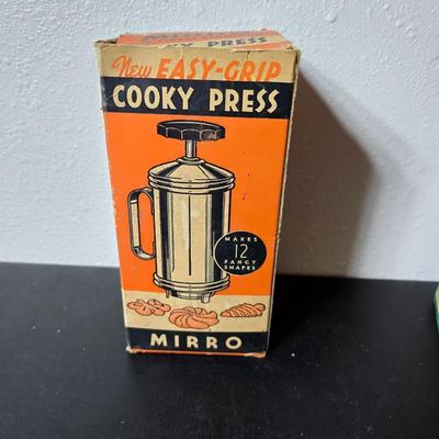 Vintage set of Griswold Patty Molds - Mirro "New Easy-Grip Cooky Press" in its original box and a vintage combination cake...