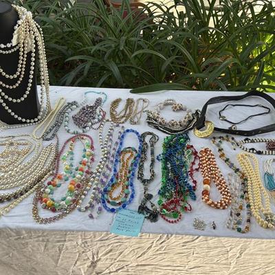 Sale Photo Thumbnail #38: Costume Jewelry Necklaces 64 beaded, Many lengths and sizes of faux pearl strands. Mardi Gras beads not included in count. Display NOT included.