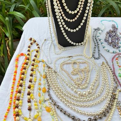 Sale Photo Thumbnail #40: Costume Jewelry Necklaces 64 beaded, Many lengths and sizes of faux pearl strands. Mardi Gras beads not included in count. Display NOT included.