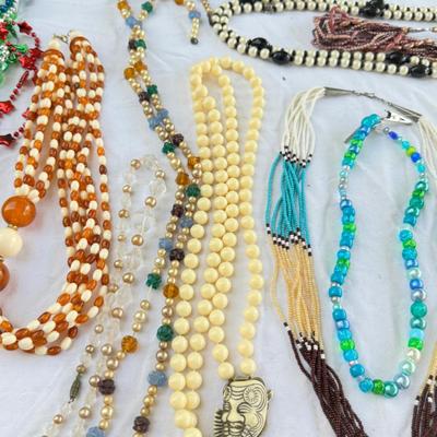 Sale Photo Thumbnail #46: Costume Jewelry Necklaces 64 beaded, Many lengths and sizes of faux pearl strands. Mardi Gras beads not included in count. Display NOT included.