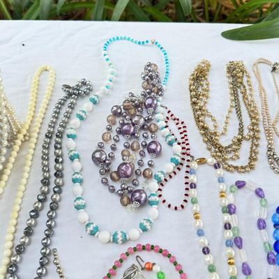Sale Photo Thumbnail #43: Costume Jewelry Necklaces 64 beaded, Many lengths and sizes of faux pearl strands. Mardi Gras beads not included in count. Display NOT included.