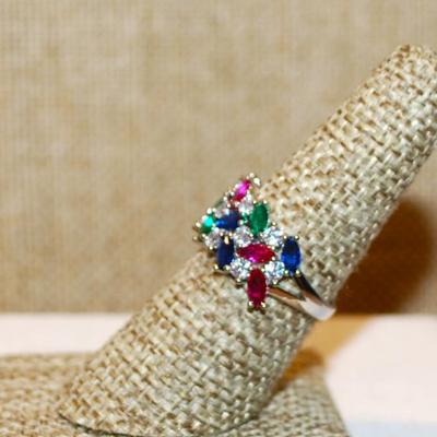 Size 7 Red, Green. Blue & Clear Stones Party Ring on a Silver Tone Band (4.2g)