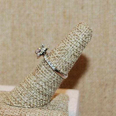 Size 6 Round Clear Main Stone in a Nested Surround Ring with Side Accent Stones & INSIDE Rose Gold Silver Tone Band (3.1g)