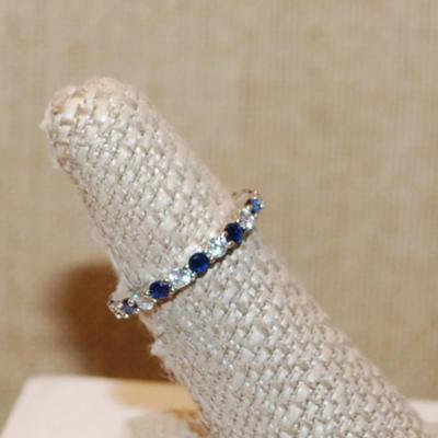 Size 6¼ Infinity Style Ring with Blue & Clear Alternating Stones on a Silver Tone Band (2.3g)