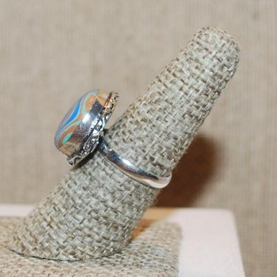 Size 7 Marked .925 Round RAINBOW CALSILICA Gemstone Ring with Full Slanted Lines in Blues & Orange and Silver-Plated Band (5.4g)