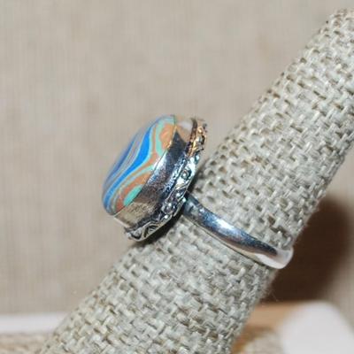Size 7 Marked .925 Round RAINBOW CALSILICA Gemstone Ring with Full Slanted Lines in Blues & Orange and Silver-Plated Band (5.4g)