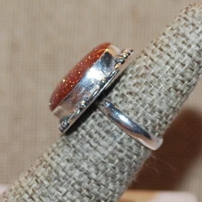 Size 6 Large Oval Glittery Rust Colored SUNSTONE Gemstone Ring with Silver Tone Band (7.5g)