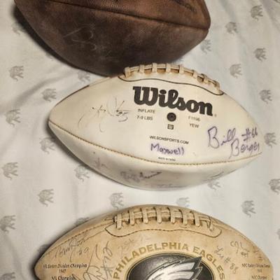 3 footballs 2 of them are signed by Eagles