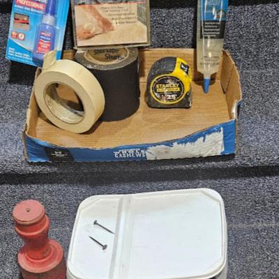 10 lb nails (1.5 inch), ten pound iron weight (red), tape, loctite, etc.
