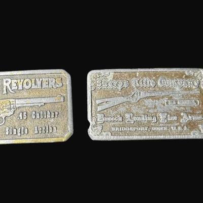 Sale Photo Thumbnail #96: Includes Colt Revolvers, and Sharp's Rifle Company. Total of two pieces. Age related wear throughout. Sharp's belt buckle has some minor damage on corner (pictured). [JP]
