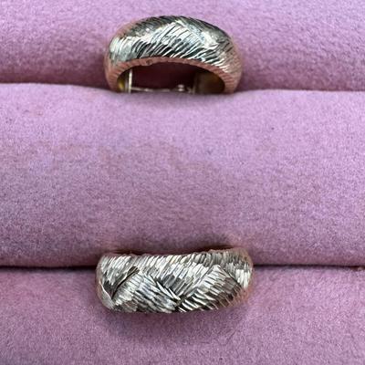 Sale Photo Thumbnail #105: **WIRE TRANSFER IS REQUIRED IF SHIPPED.** [1.72g] These diamond cut earrings are fashioned in yellow gold. There are some minor dents on the inside of these hoops when viewed under magnification. Approximate diameter is .75". **ALL PRECIOUS METALS SALES A