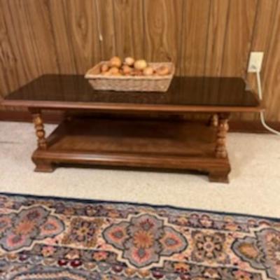Sale Photo Thumbnail #16: A very nice Ethan Allen solid wood coffee table. Also has a glass top to protect the wood top.Dimensions are 16" Tall 48" long & 21" deep