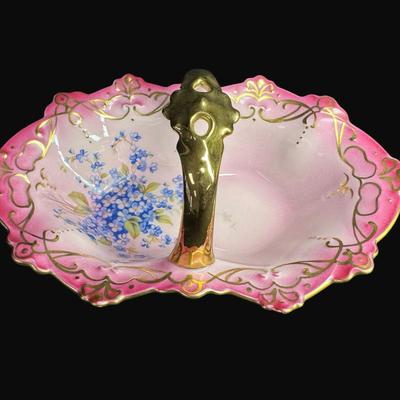 Sale Photo Thumbnail #164: Pink in color, with gold accents. Includes an Art Nouveau vase (9"H), a handled carafe (9.5"), and a handled candy dish. Total of three pieces. [RE]