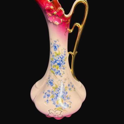Sale Photo Thumbnail #161: Pink in color, with gold accents. Includes an Art Nouveau vase (9"H), a handled carafe (9.5"), and a handled candy dish. Total of three pieces. [RE]