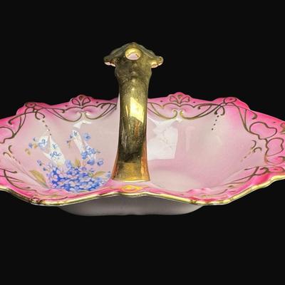 Sale Photo Thumbnail #163: Pink in color, with gold accents. Includes an Art Nouveau vase (9"H), a handled carafe (9.5"), and a handled candy dish. Total of three pieces. [RE]