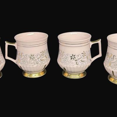 Sale Photo Thumbnail #168: Footed mug set with gold accents. Age related wear. Total of four pieces. Measurement: 3.75"H (each). [RE]