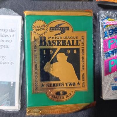 UNOPENED PACKAGES OF SPORTS TRADING CARDS