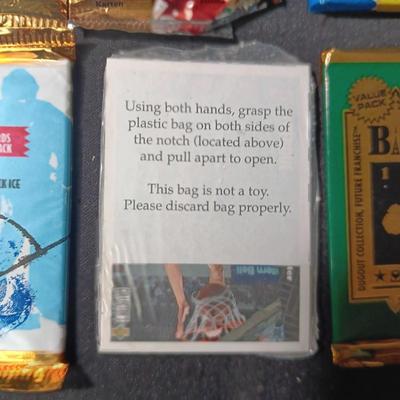 UNOPENED PACKAGES OF SPORTS TRADING CARDS