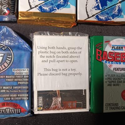 UNOPENED PACKAGES OF SPORTS TRADING CARDS