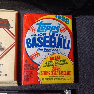 UNOPENED PACKAGES OF SPORTS TRADING CARDS