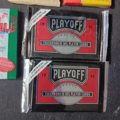 UNOPENED PACKAGES OF SPORTS TRADING CARDS