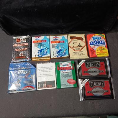 UNOPENED PACKAGES OF SPORTS TRADING CARDS