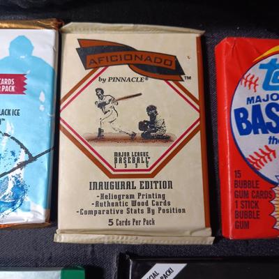 UNOPENED PACKAGES OF SPORTS TRADING CARDS