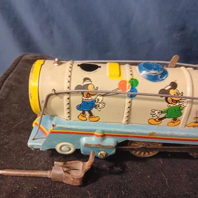WALT DISNEY PRODUCTIONS TIN LITHO WIND UP TRAIN BY MARX (IN NEED OF REPAIR)