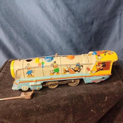 WALT DISNEY PRODUCTIONS TIN LITHO WIND UP TRAIN BY MARX (IN NEED OF REPAIR)