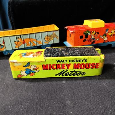 WALT DISNEY PRODUCTIONS TIN LITHO WIND UP TRAIN BY MARX (IN NEED OF REPAIR)