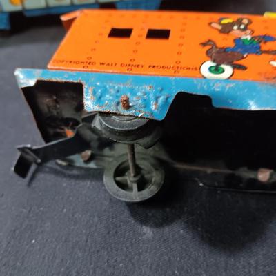WALT DISNEY PRODUCTIONS TIN LITHO WIND UP TRAIN BY MARX (IN NEED OF REPAIR)