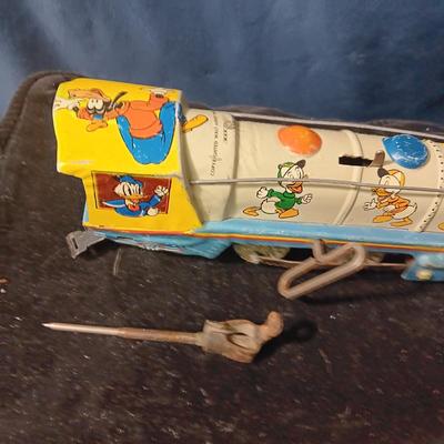 WALT DISNEY PRODUCTIONS TIN LITHO WIND UP TRAIN BY MARX (IN NEED OF REPAIR)