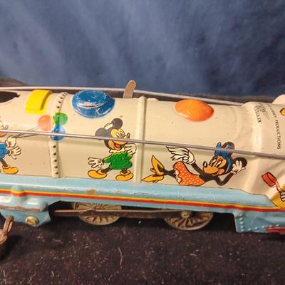 WALT DISNEY PRODUCTIONS TIN LITHO WIND UP TRAIN BY MARX (IN NEED OF REPAIR)