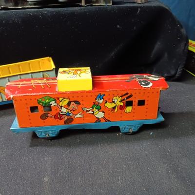 WALT DISNEY PRODUCTIONS TIN LITHO WIND UP TRAIN BY MARX (IN NEED OF REPAIR)