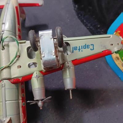 CAPITAL AIRLINES TIN LITHO TOY AIRPLANEE IN FAIR CONDITION AND 2 METAL CYMBALS? WITH GREAT GRAPHICS