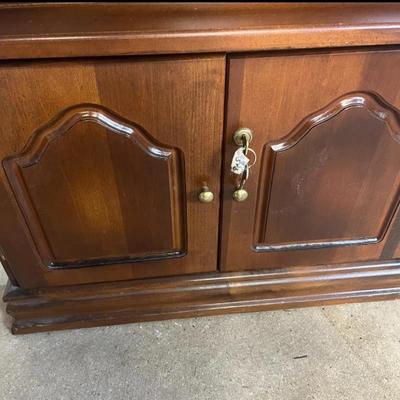 Sale Photo Thumbnail #46: 25×10×71 wooden cabinet with glass door and lower storage.
