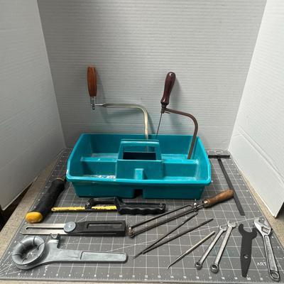 Sale Photo Thumbnail #95: Compact kit with saws, files, and wrenches in a teal organizer tray.