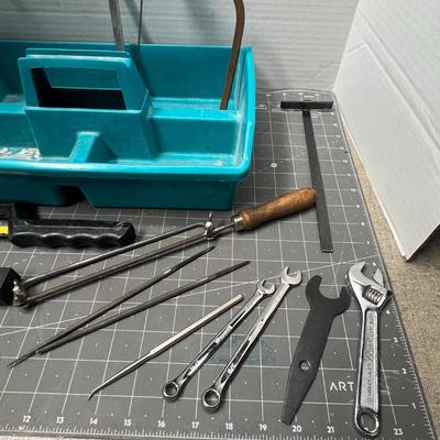 Sale Photo Thumbnail #96: Compact kit with saws, files, and wrenches in a teal organizer tray.