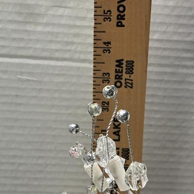 Sale Photo Thumbnail #147: Elegant decorative lighted tree with silver base and crystals.