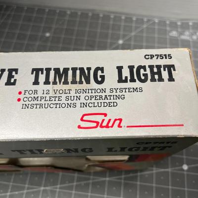 Sale Photo Thumbnail #156: Heavy-duty die-cast timing light for 12-volt systems.