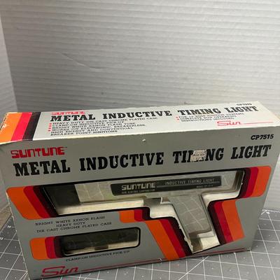 Sale Photo Thumbnail #153: Heavy-duty die-cast timing light for 12-volt systems.