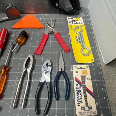 Sale Photo Thumbnail #176: Includes pliers, screwdrivers, knife, square, anchors, wrench, cutter.
